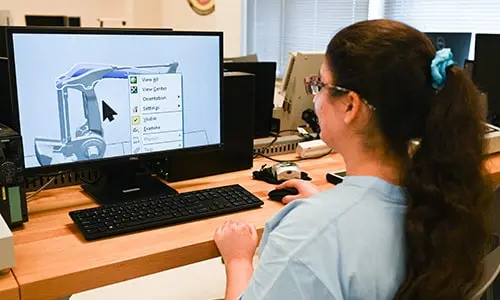 female student working on computer